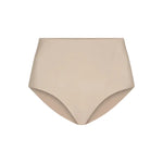 The Commando Zone Smoothing Brief is a beige high-waisted shapewear for women, featuring smoothing panels and a seamless design, shown against a plain white background.