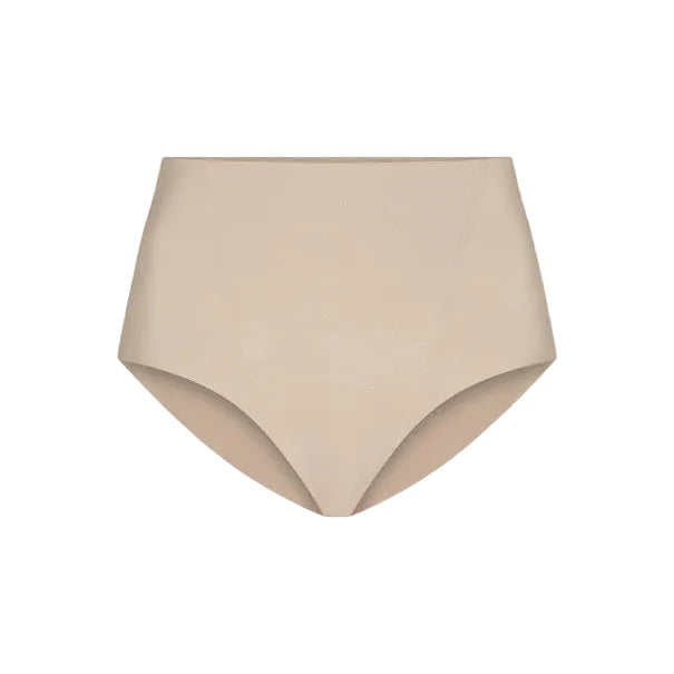 The Commando Zone Smoothing Brief is a beige high-waisted shapewear for women, featuring smoothing panels and a seamless design, shown against a plain white background.