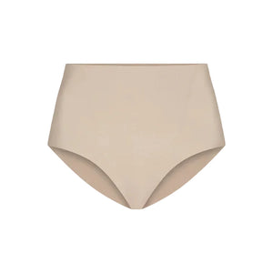 The Commando Zone Smoothing Brief is a beige high-waisted shapewear for women, featuring smoothing panels and a seamless design, shown against a plain white background.
