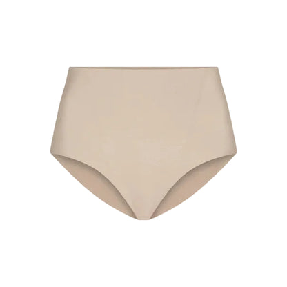 The Commando Zone Smoothing Brief is a beige high-waisted shapewear for women, featuring smoothing panels and a seamless design, shown against a plain white background.