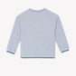 The Boys’ Heather Sweatshirt by Tartine et Chocolat is displayed from the back against a plain white background, featuring a light gray color with blue and white striped trim on the cuffs and hem.