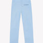 The Boys’ Cotton Trousers by Tartine et Chocolat are displayed from the back in light blue, featuring classic coastal colors, belt loops, a single back pocket with a contrasting dark trim, and straight legs—an effortless seaside essential presented against a plain white background.