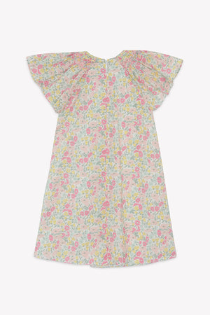 The Tartine et Chocolat Girls’ Liberty Print Dress, shown on a plain white background, is a short-sleeve cotton dress with a pastel floral Liberty print, featuring wide flutter sleeves, a smocked collar, and a loose knee-length fit.