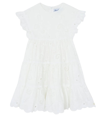 Tartine et Chocolat Girls’ Openwork Dress features delicate eyelet embroidery, ruffled short sleeves, and a scalloped hem. This charming white summer dress is perfect for warm-weather occasions and is displayed on a plain background.
