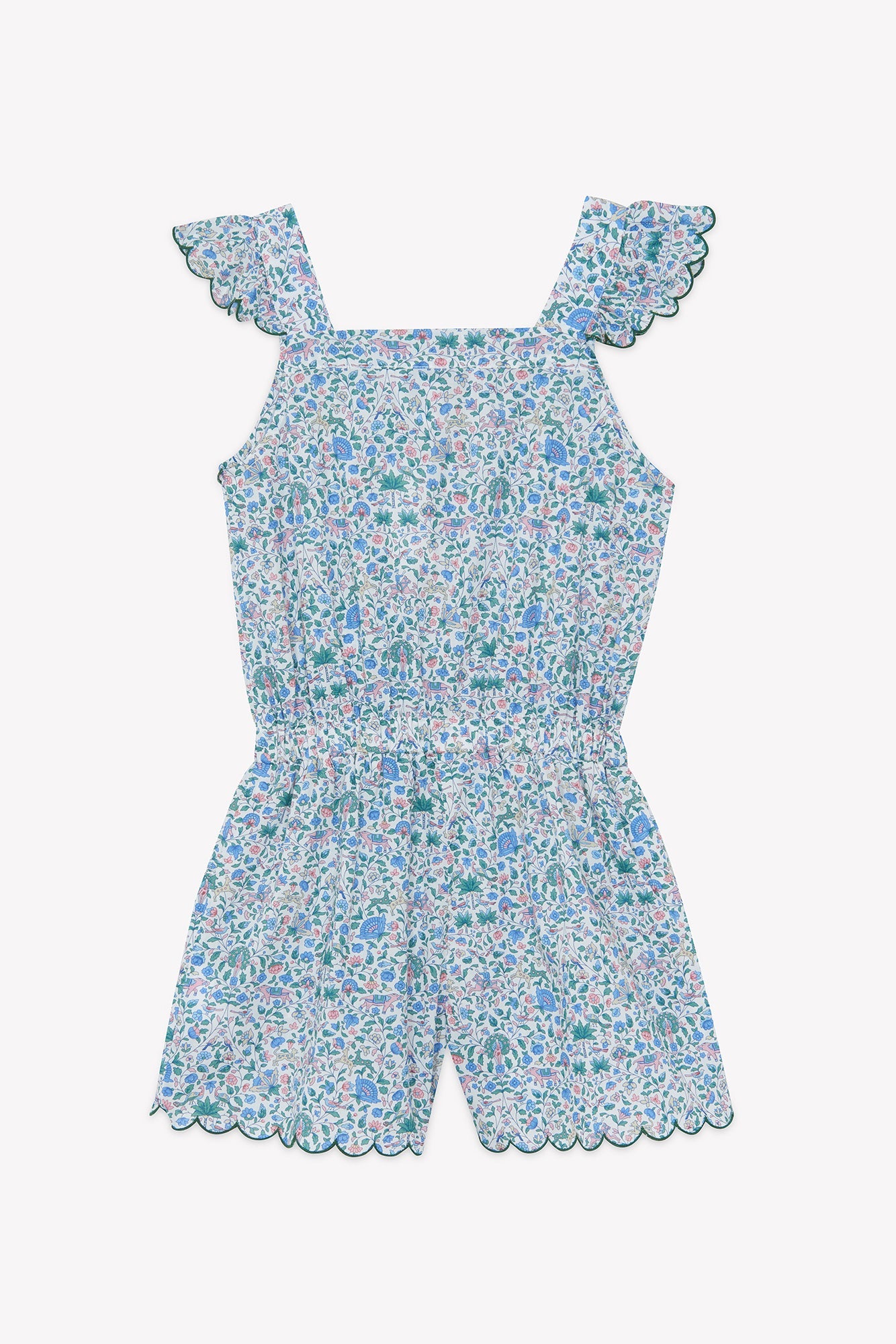 The Girls’ Liberty Print Short Jumpsuit by Tartine et Chocolat features scalloped edges at the shoulders and shorts, with a delicate small floral print in blue, green, and pink on a white background.