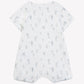 The Tartine et Chocolat Baby Boys’ Hot Air Balloon Short Jumpsuit is a white, short-sleeve cotton romper featuring thin vertical stripes and small blue hot air balloon illustrations, shown laid flat with a back view.