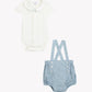 Dress your little one in the Baby Boys’ Pointed Collar Overall Outfit from Tartine et Chocolat, featuring a crisp white short-sleeve bodysuit with a pointed collar paired with light blue suspender shorts. The dungaree-style shorts are accented with front buttons and delicately embroidered hot air balloons, adding a playful touch to this charming ensemble.