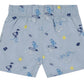 Tartine et Chocolat Baby Boys’ and Boys’ Swim Short in light blue, featuring an elasticated waistband and playful cartoon prints of ducks, surfboards, suns, waves, and beach balls in blue, yellow, and white—ideal for fun-filled days at the beach.