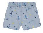 Tartine et Chocolat Baby Boys’ and Boys’ Swim Short in light blue, featuring an elasticated waistband and playful cartoon prints of ducks, surfboards, suns, waves, and beach balls in blue, yellow, and white—ideal for fun-filled days at the beach.