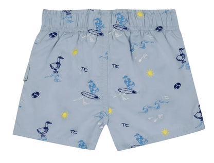 Tartine et Chocolat Baby Boys’ and Boys’ Swim Short in light blue, featuring an elasticated waistband and playful cartoon prints of ducks, surfboards, suns, waves, and beach balls in blue, yellow, and white—ideal for fun-filled days at the beach.