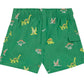 Sure! Here’s your rewritten sentence using the provided product data: The Tartine et Chocolat Baby Boys’ and Boys’ Swim Short features a vibrant green color, an elasticated waistband, and playful multicolored dinosaur patterns—including Stegosaurus, Triceratops, and Pterodactyl—making it perfect for fun beach days. Designed with a convenient small side pocket on the right.