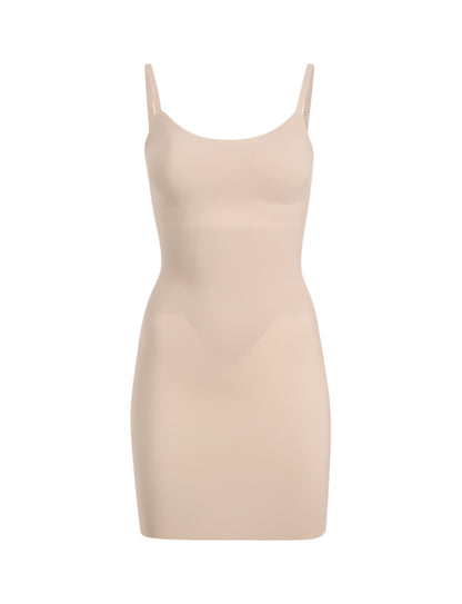 The Commando Zone Smoothing Full Slip is a beige, sleeveless bodycon dress with thin straps and targeted compression for a smooth silhouette, shown against a plain white background.