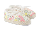 The Baby Girls’ Liberty Fabric Espadrille Slipper from Tartine et Chocolat is crafted from charming Liberty fabric, features white laces, a delicate pastel floral print, and classic rope-style soles for the perfect cotton espadrilles look.