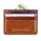A hand-stitched Italian leather Card Wallet by Smathers & Branson, this brown cardholder displays a $20 bill, a blue credit card, and a Virginia driver’s license partially visible in its slots.