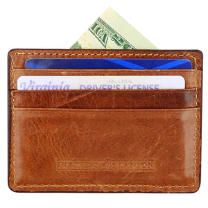 A Smathers & Branson American Flag Card Wallet with cash, a blue card, and a Virginia driver's license visible in its slots.