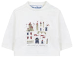 The Tartine et Chocolat Baby Boys’ and Boys’ Castle Print Cotton T-Shirt is a white, long-sleeved top made from soft unbleached cotton, featuring an enchanting castle illustration with towers and red flags, and the “Tartine et Chocolat” logo elegantly written beneath the print.