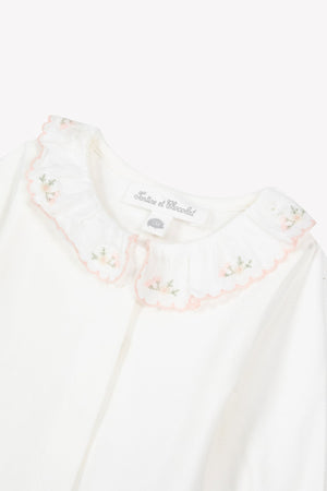 The Tartine et Chocolat Baby Girls’ Ruffled Collar Bodysuit features ecru white cotton with long sleeves and a ruffled floral collar adorned with pink embroidered flowers.