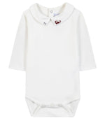 The Tartine et Chocolat Baby Boys’ Dinosaur Bodysuit features a white long-sleeve cotton design with a Peter Pan collar, button closure at the back, and snap buttons at the bottom; an embroidered red dinosaur on the collar adds a playful touch to this adorable baby romper.