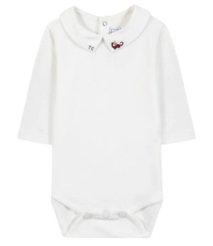 The Tartine et Chocolat Baby Boys’ Dinosaur Bodysuit features a white long-sleeve cotton design with a Peter Pan collar, button closure at the back, and snap buttons at the bottom; an embroidered red dinosaur on the collar adds a playful touch to this adorable baby romper.