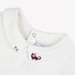 Close-up of the Tartine et Chocolat Baby Boys’ Dinosaur Bodysuit, featuring a white collar with “TC” embroidered on one tip and a playful red cat motif on the other, echoing the charming details often seen in high-quality baby rompers.