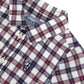 Tartine et Chocolat Baby Boys’ and Boys’ Cotton Check Shirt featuring a classic red, white, and blue plaid pattern, collared neckline with buttons, and an embroidered navy blue logo on the chest. Made from comfortable and durable unbleached cotton, this elegant shirt includes a visible brand label inside the collar.