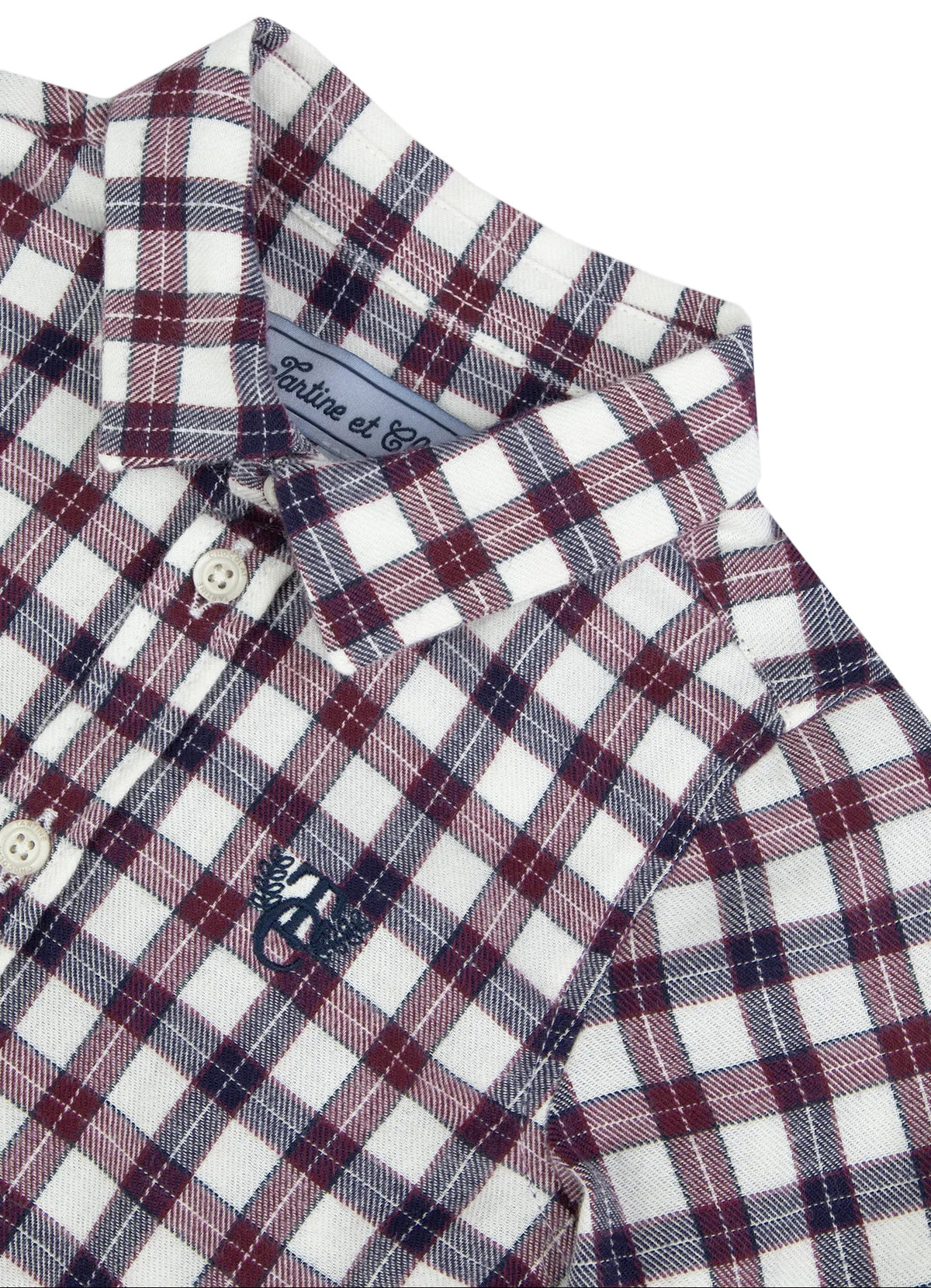 Tartine et Chocolat Baby Boys’ and Boys’ Cotton Check Shirt featuring a classic red, white, and blue plaid pattern, collared neckline with buttons, and an embroidered navy blue logo on the chest. Made from comfortable and durable unbleached cotton, this elegant shirt includes a visible brand label inside the collar.