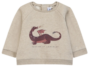 Tartine et Chocolat Baby Boys’ and Boys’ Dragon Print Cotton Sweater in beige cotton, featuring long sleeves, a whimsical purple dragon print, and the brand’s signature logo beneath the illustration.
