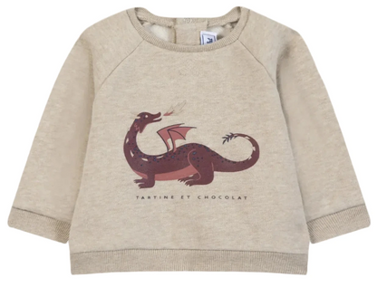 Beige cotton sweater for baby boys and boys by Tartine et Chocolat, featuring a bold red and purple dinosaur print with “Tartine et Chocolat” text printed below the image.