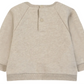 Light beige long-sleeve Baby Boys’ and Boys’ Dinosaur Print Cotton Sweater by Tartine et Chocolat shown from the back, featuring a round neckline, two back snap buttons, and ribbed cuffs and hem.