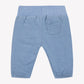 Tartine et Chocolat Baby Boys’ Corduroy Trousers in light blue, crafted from 100% cotton with an elastic waistband and cuffs, and a small patch pocket on the back, are displayed on a white background.