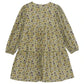 The Girls’ Liberty Embroidery Round Neck Cotton Dress by Tartine et Chocolat is a long-sleeved, knee-length dress adorned with a vibrant yellow, purple, and green floral print on a white background, inspired by an English garden and finished with delicate Liberty flower embroidery.