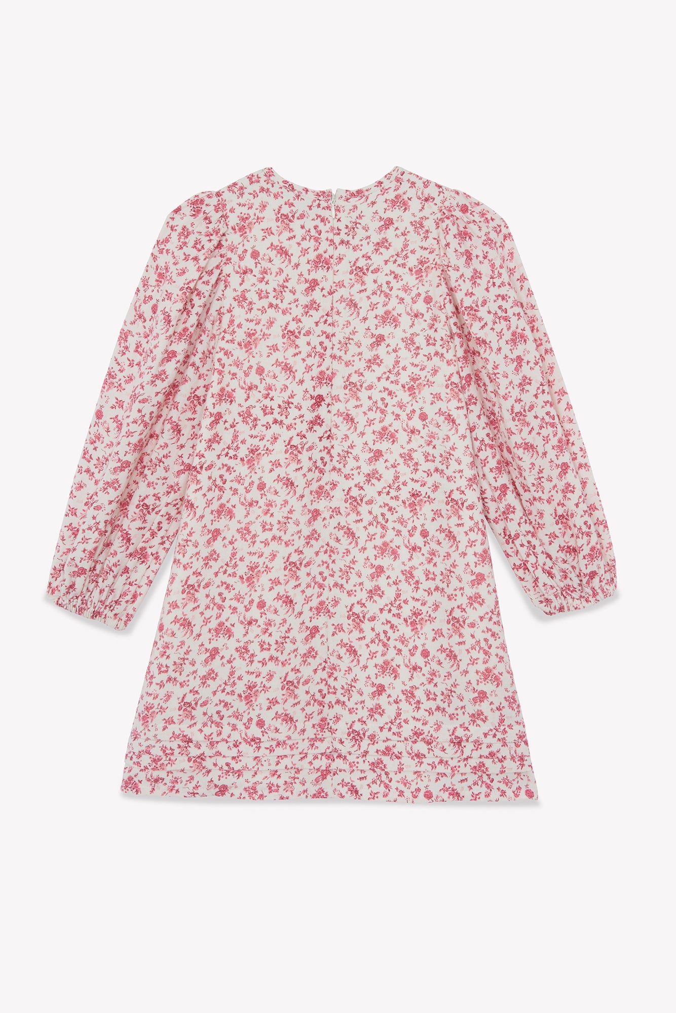 Tartine et Chocolat Girls’ Flowery Print Cotton Dress—a long-sleeve, knee-length dress featuring a pink floral print on a white background—is displayed laid flat on a white surface.