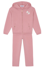 Tartine et Chocolat Girls’ Wool Hood Cotton Jogging Suit in pink features a hooded zip-up jacket with a gold zipper, subtle white graphic detail, and convenient pockets, paired with matching pants also equipped with pockets.
