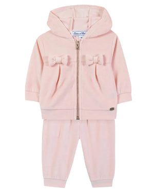 The Tartine et Chocolat Baby Girls’ Jogging Suit Outfit is a light pink toddler hoodie and pants set designed as a cozy tracksuit, featuring a front zipper, hooded jacket, and two decorative bows on the jacket—a charming addition to any baby clothing collection.