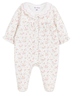 The Tartine et Chocolat Baby Girls’ Ruffle Collar Pajama features a charming long-sleeve design with a delicate pink floral pattern, ruffled cuffs, and a scalloped white collar. Made from soft, comfortable unbleached cotton, these pajamas are gentle on delicate skin and perfect for cozy nights.