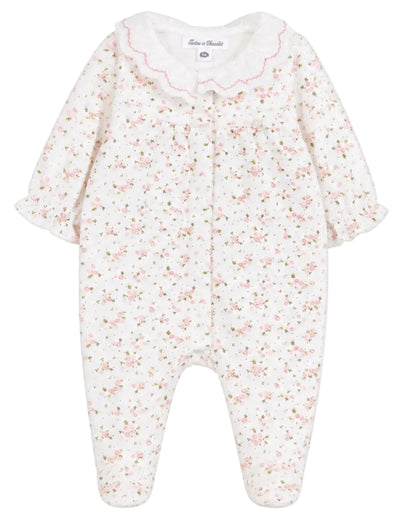 The Tartine et Chocolat Baby Girls’ Ruffle Collar Pajama features a charming long-sleeve design with a delicate pink floral pattern, ruffled cuffs, and a scalloped white collar. Made from soft, comfortable unbleached cotton, these pajamas are gentle on delicate skin and perfect for cozy nights.