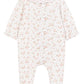 The Tartine et Chocolat Baby Girls’ Ruffle Collar Pajama is a white onesie with long sleeves and feet, adorned with a pink floral pattern and a scalloped collar trimmed in pink. Crafted from soft fabric for comfortable sleep, it features gently ruffled cuffs for an extra touch of charm.