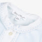 Close-up of the Baby Boys’ Velvet Pointed Collar Pajamas in light blue by Tartine et Chocolat, featuring a white collar delicately embroidered with the letters “T” and “C,” blue stitching, and buttons. This charming piece captures the timeless elegance of pointed collar pajamas, making it an exceptional choice for baby boys’ sleepwear.