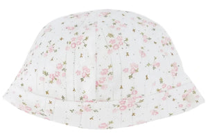 The Tartine et Chocolat Beanie is a white baby hat adorned with a delicate pattern of small pink flowers and green stems, crafted from soft unbleached cotton and featuring a folded brim.
