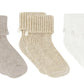 The Cotton Sock Set by Tartine et Chocolat features three pairs of ribbed knit toddler socks—one gray, one beige, and one white—all with turned-down cuffs, displayed side by side on a white background.