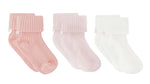 The Cotton Sock Set by Tartine et Chocolat features three pairs of ribbed baby socks in pink, light pink, and white, each adorned with a folded cuff and a delicate side bow. Displayed on a white background, these charming socks are designed to offer both comfort and style for your little one.