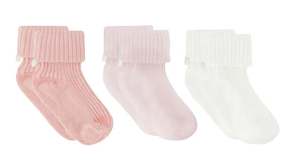 The Cotton Sock Set by Tartine et Chocolat features three pairs of ribbed baby socks in pink, light pink, and white, each adorned with a folded cuff and a delicate side bow. Displayed on a white background, these charming socks are designed to offer both comfort and style for your little one.