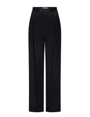The Cecilia Trouser by Victoria Beckham is a black wide-leg tailored style featuring front pleats, a high waist, belt loops, and a concealed front closure, showcased against a plain white background for a modern aesthetic.
