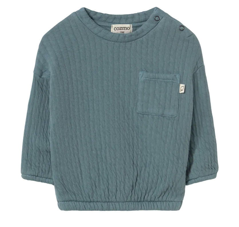 The Cozmo Baby Boys’ Chipre Quilted Sweatshirt is a teal, long-sleeve organic cotton sweatshirt featuring a chest pocket with a small brand label, two shoulder snaps for easy changing, and cozy quilted fabric—ideal for comfy fall and winter baby clothes.