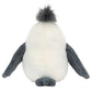 The back view of the Jellycat Chip Seagull plush toy reveals a white body, gray flippers and feet, complemented by a tuft of dark gray fur on top, capturing the charm of a beach bird.