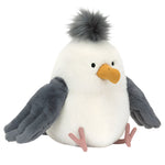 The Jellycat Chip Seagull is a plush toy resembling a beach bird with a fluffy gray crest, orange beak, gray wings, and pink feet, sitting upright.
