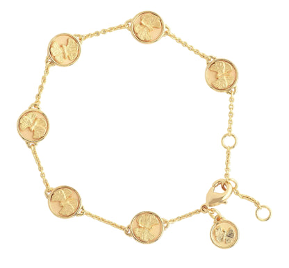 The Anabel Aram Butterfly Coin Charm Bracelet features six round coin charms and a four-leaf clover charm near the clasp. This adjustable 18k gold bracelet is shown on a white background.