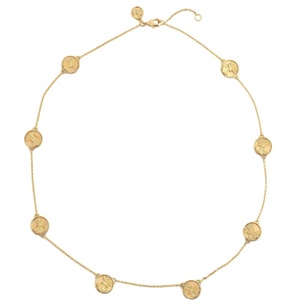The Butterfly Coin Station Necklace by Anabel Aram features evenly spaced round charms on a delicate, 18k gold dipped chain, shown on a white background.