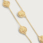 The Anabel Aram Butterfly Coin Station Necklace features round medallion pendants with raised butterfly designs in an 18k gold dipped finish, elegantly displayed on a plain background.
