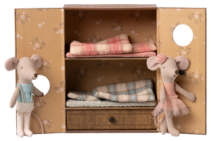 Two Ballet Mice in Dance Studio by Maileg stand beside an open mouse house wardrobe with bunk beds and folded blankets inside.